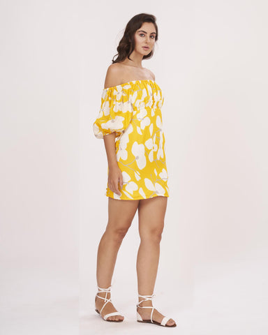 Yellow muslin dress with an off-shoulder neckline and a fitted bodice