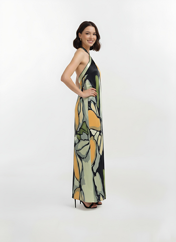 Full Maxi-length sleeveless maxi dress featuring a high halter-neck design and an open back, showcasing a fluid, straight-cut silhouette.