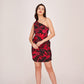 Model wearing a black one-shoulder floral mini dress with red print, posing front-facing with hands at her sides.