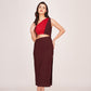 Model wearing a brown and red one-shoulder satin date night dress, standing front-facing with hands on waist.