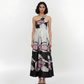 One-shoulder crepe maxi dress with a fitted waistband and flowy A-line silhouette, featuring an abstract floral-inspired print for elegant evening occasions.