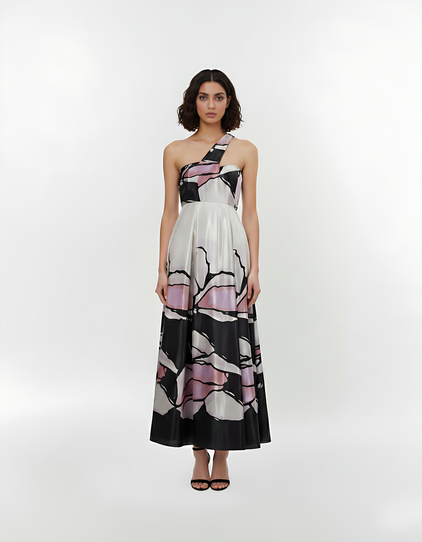 One-shoulder crepe maxi dress with a fitted waistband and flowy A-line silhouette, featuring an abstract floral-inspired print for elegant evening occasions.