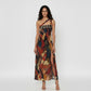 Asymmetrical one-shoulder maxi dress featuring a striped upper section and bold abstract print below