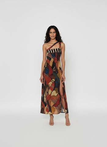 Asymmetrical one-shoulder maxi dress featuring a striped upper section and bold abstract print below