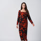 Overlapped-neck abstract print chinon dress in orange and black, ideal for stylish occasions and refined events