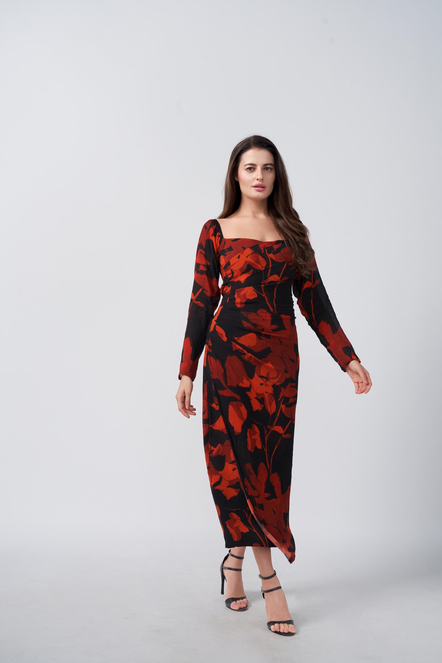 Side-facing pose highlighting the flow and length of the chinon dress.