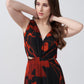 Close-up view highlighting the V-neckline and gathered bodice of the floral dress.