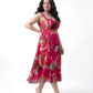 Detail of oversized floral and abstract print on a lightweight pink chinon midi dress
