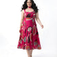Pink floral chinon midi dress with a sweetheart neckline and tie-up straps, designed for a flattering resort-ready look