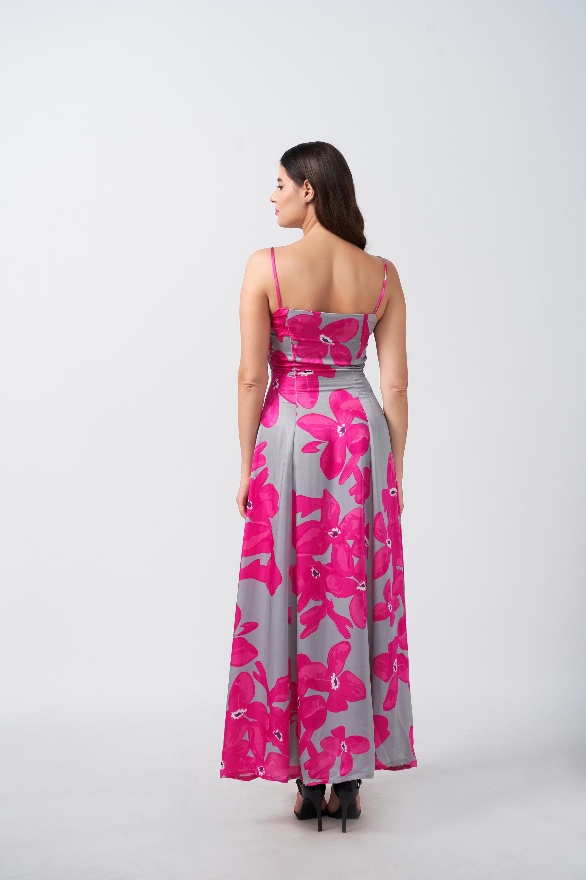 Rear angled view of the satin maxi dress, displaying its smooth fall and silhouette.