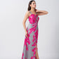 Model walking forward in satin pink and grey floral maxi dress, showcasing the fluid drape and movement.
