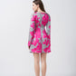 Rear view of the satin short dress with pink and grey floral print, focusing on the back fit and sleeve detail.