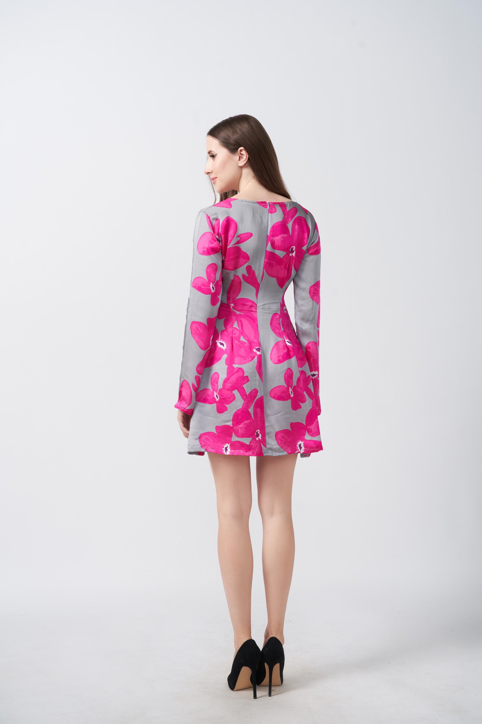 Rear view of the satin short dress with pink and grey floral print, focusing on the back fit and sleeve detail.