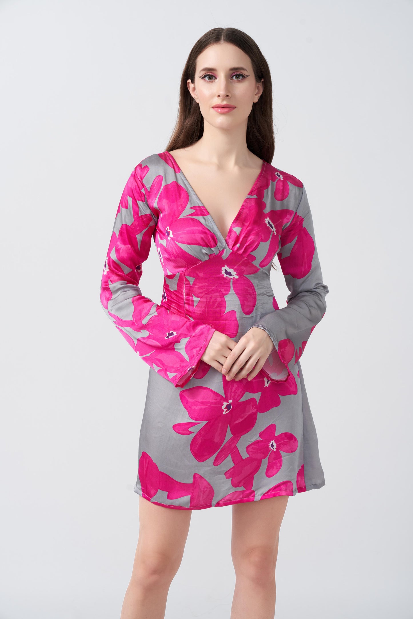 Front view of model in pink and grey floral short dress, showcasing the balanced silhouette and vibrant print.