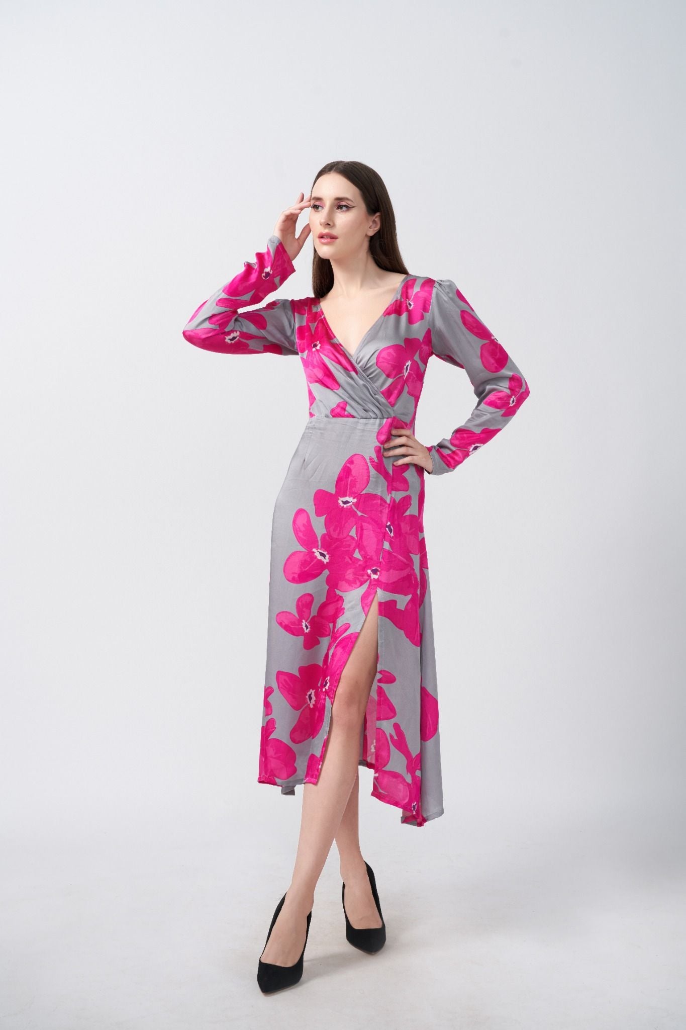 Model showing side pose in pink floral satin dress with soft grey base, highlighting the flow and fit.