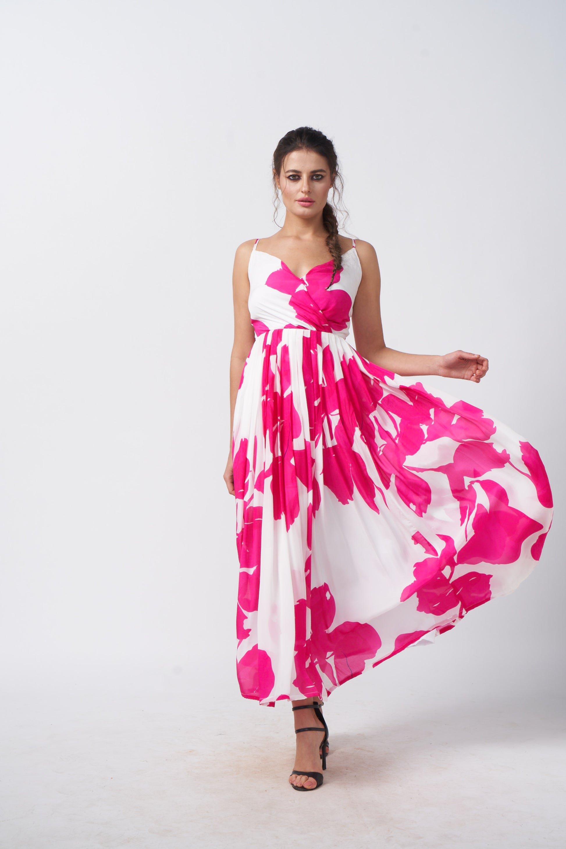 Model in mid-motion, highlighting the dress’s volume and movement from a front angle.