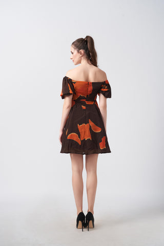 Short abstract print crepe dress in warm orange and brown tones, ideal for daytime gatherings and relaxed social events
