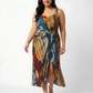 Plus size flowy midi dress with bold geometric print and elegant front slit for movement