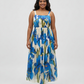 Plus size blue floral chinon maxi dress with a square neckline and pleated skirt