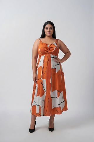 Plus size burnt orange and white abstract cotton satin midi dress with a twisted neckline