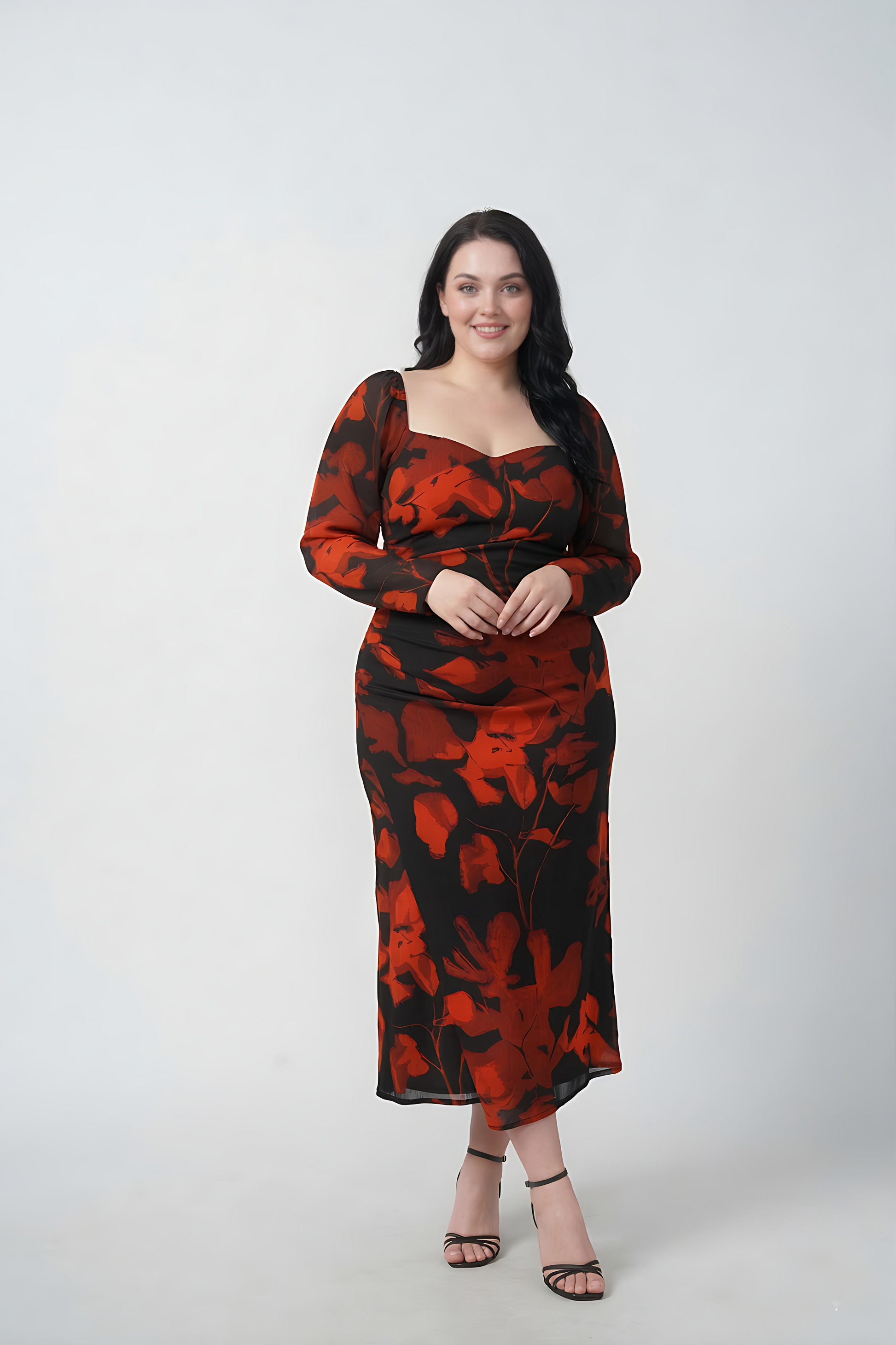Plus size orange and black floral chinon ankle-length dress with an overlapped neckline and long sleeves