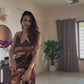 Flowing abstract print maxi dress in rich earthy tones, designed for destination vacations, resort dinners, and elegant holiday evenings.