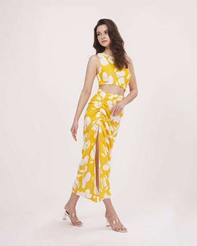 Yellow printed muslin co-ord set with a one-shoulder top, suitable for summer brunches and daytime outings