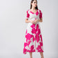Floral crepe midi dress in pink and white tones, ideal for elegant daytime events and social gatherings