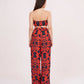 Back view of printed co-ord set showing back hook closure crop top and relaxed muslin pants with bold multicolor pattern.