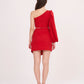 Rear view of the outfit with model standing relaxed, showcasing the back fit of the off-shoulder top and the mini skirt's tailored closure