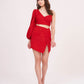 Full-length front pose showing the entire co-ord set, including the bold one-shoulder sleeve, flattering fit of the crop top, and rose-inspired mini skirt with front slit.