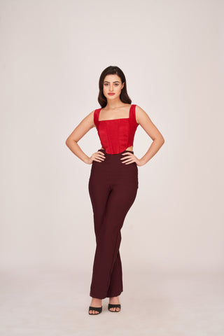 Two-piece set featuring a structured red corset top paired with high-waisted dark maroon trousers. The Rouge Fusion Ensemble offers a sleek, modern silhouette.