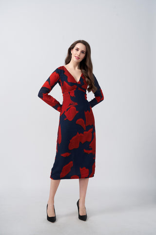 Midi-length dress featuring a bold abstract floral print in scarlet red against a deep navy blue background. The design showcases a flattering V-neckline and long, fitted sleeves. 