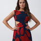 Close-up view highlighting the square neckline and abstract floral pattern of the dress.