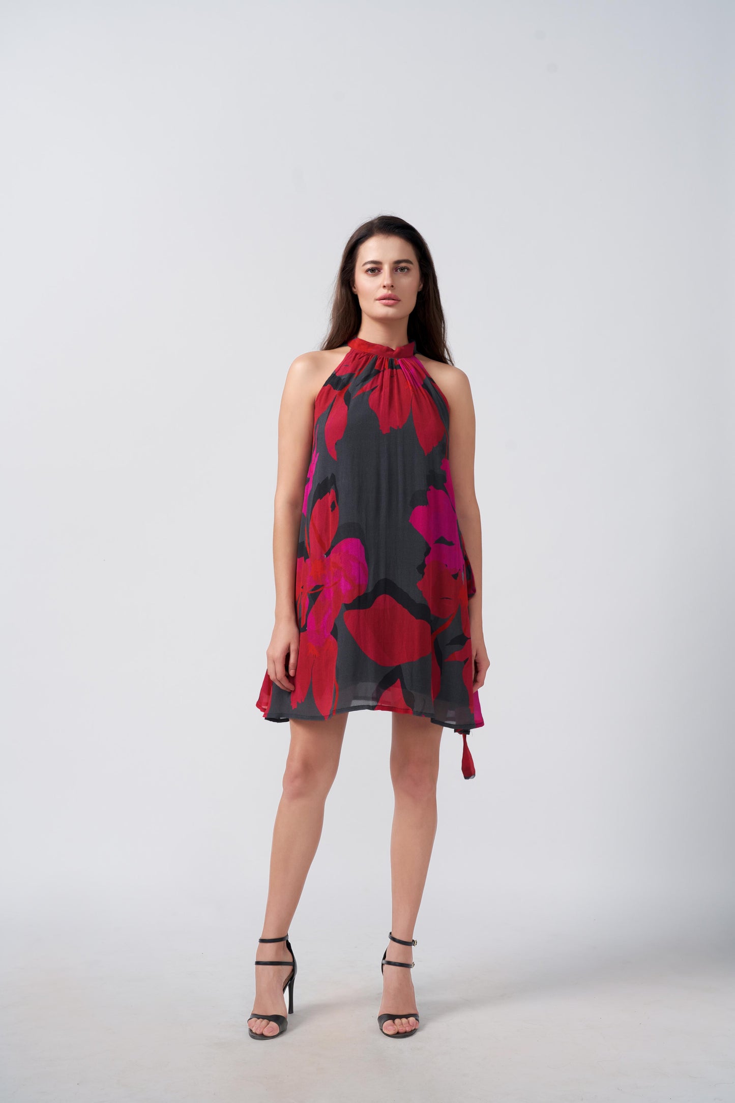Sleeveless halter-neck abstract print chinon dress, ideal for warm-weather events and stylish social occasions
