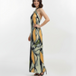 Sleeveless Olive Dawn full length maxi Dress with a straight, fluid cut and a halter neck style that transitions into an elegant open-back design.