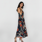 Halter-neck abstract print maxi dress with a fluid silhouette, suitable for daytime outings and resort evenings