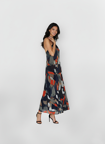 Halter-neck abstract print maxi dress with a fluid silhouette, suitable for daytime outings and resort evenings