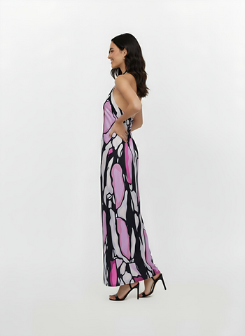 Sleeveless maxi dress with a fluid, straight cut and an elegant open-back design, showcasing a lightweight fabric with oversized painterly patterns.