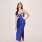 model in blue satin dress, showcasing V-neckline and shoulder strap detail.