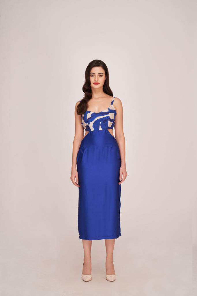 Model in royal blue satin midi dress with abstract white print, posing front-facing in studio.