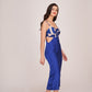 Model posing in side profile wearing digitally printed blue satin midi dress, highlighting side cut-out.