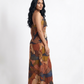 Sophisticated halter neck maxi dress with a softly draped waist and graceful silhouette, perfect for sunset soirées and festive evening celebrations.