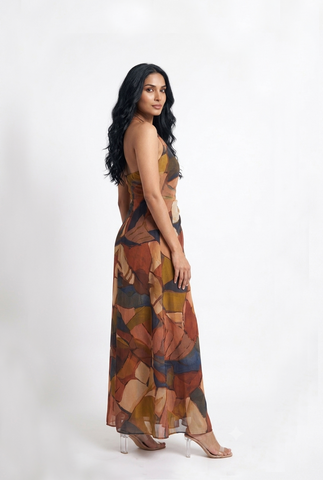 Sophisticated halter neck maxi dress with a softly draped waist and graceful silhouette, perfect for sunset soirées and festive evening celebrations.