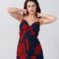 Front close-up highlighting ruched bust and spaghetti straps in abstract floral print.