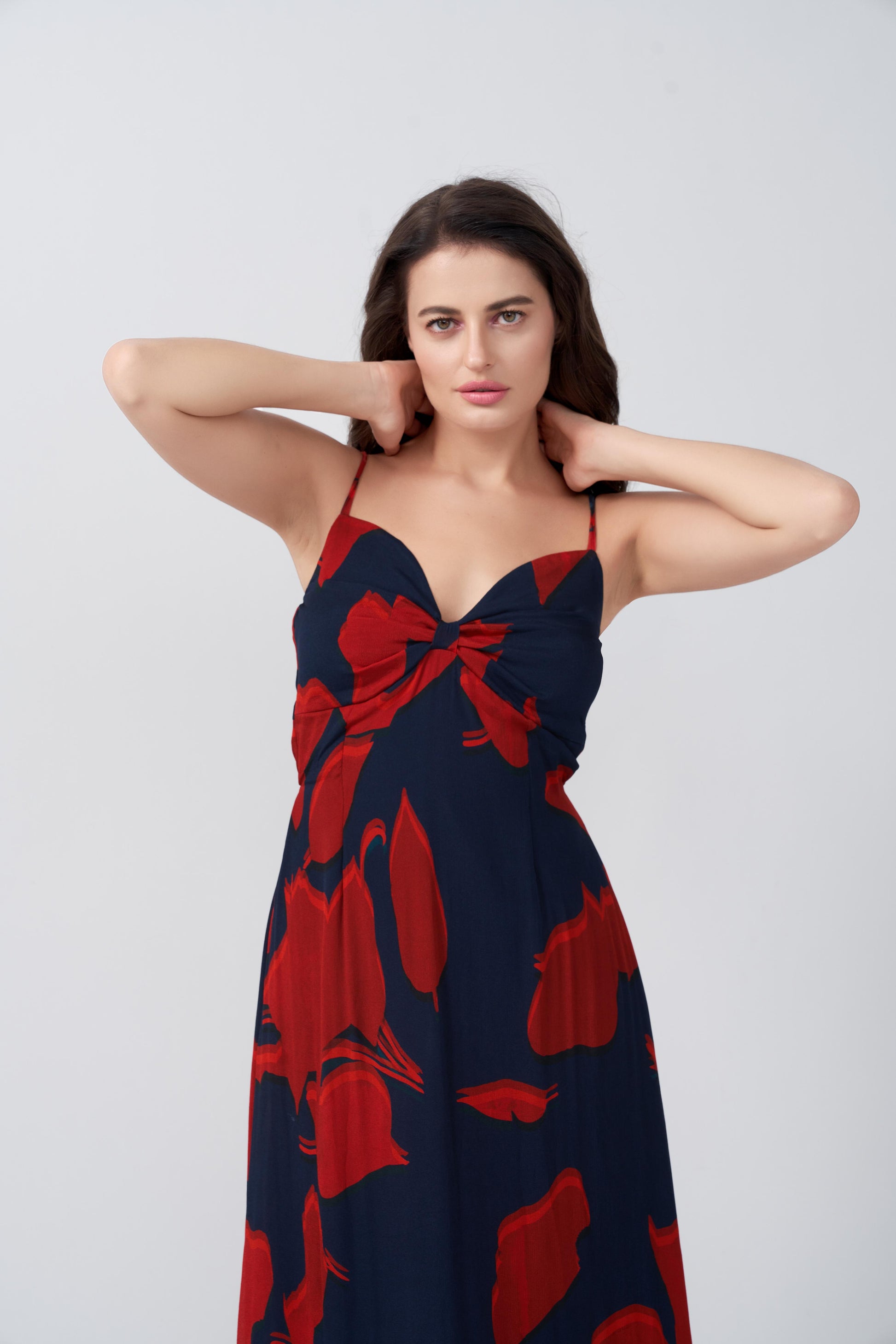 Front close-up highlighting ruched bust and spaghetti straps in abstract floral print.
