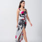Walking pose of model highlighting front slit and movement of grey and white satin dress.