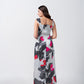 Rear view of grey and white floral print satin dress showing back silhouette.