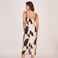 Rear view of the dress showing back zip closure, straight hem, and smooth satin flow.