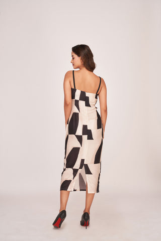 Back view of a silk midi dress with shoulder straps, side cut-outs, and a back zip closure